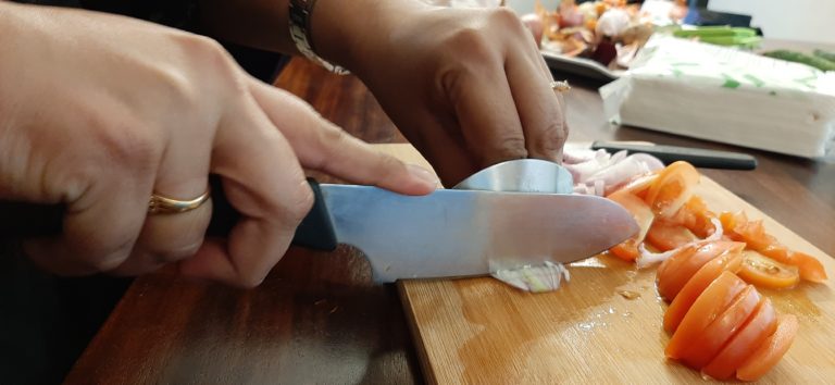 Chopping onions using the finger guard