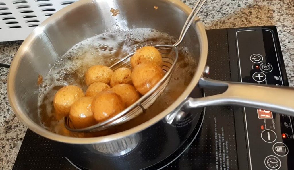 Deep frying our moong dal vadas