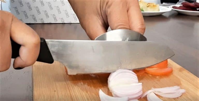 Slicing onions using the finger guard